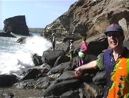 Michael, soaked from head to foot, complains that the youngsters didn't warn him about the enormous wave that was heading his way!